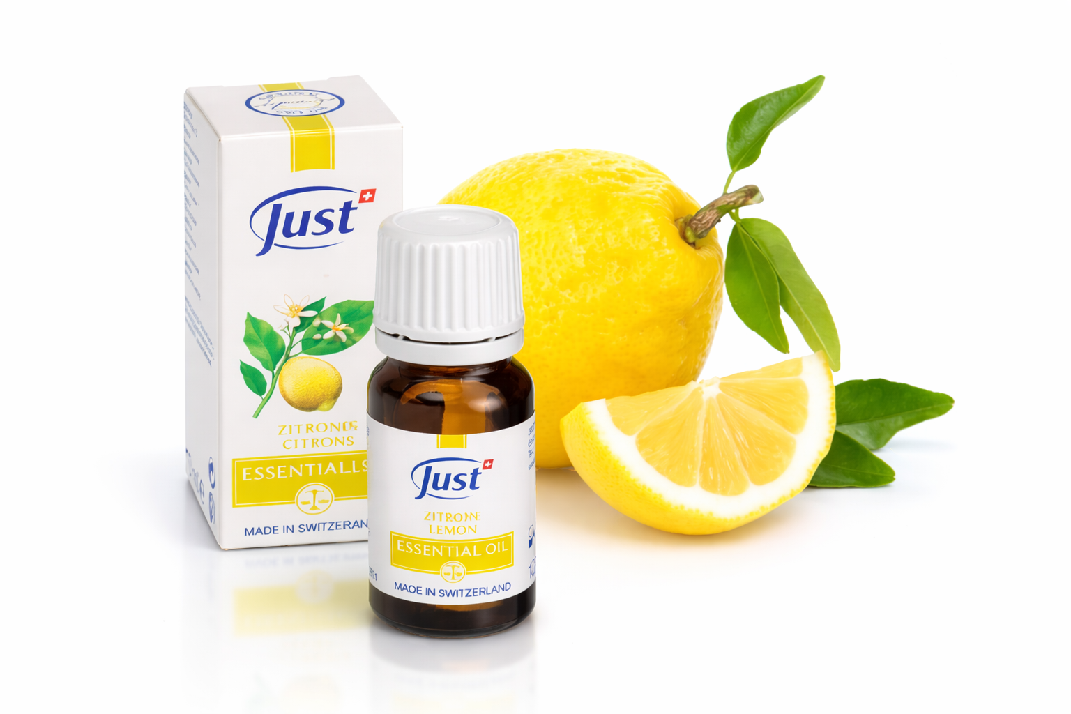 Zitronenöl von JUST mit frischer Zitrone – ätherisches Öl für Aromatherapie